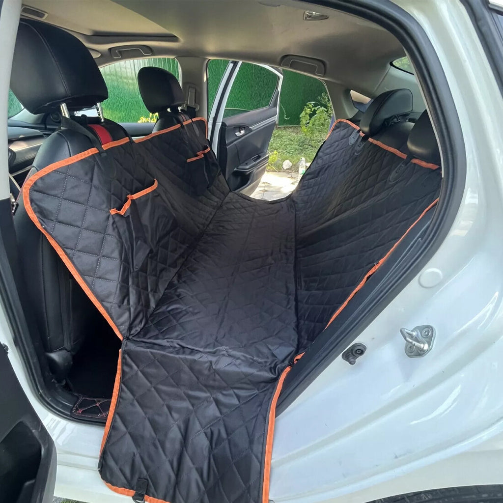Waterproof dog car seat cover installed as a hammock in a car back seat